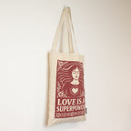 Nomad Sari Iconic Toni -kangaskassi – Love is a Super Power – luonnonvärinen, 10 oz
